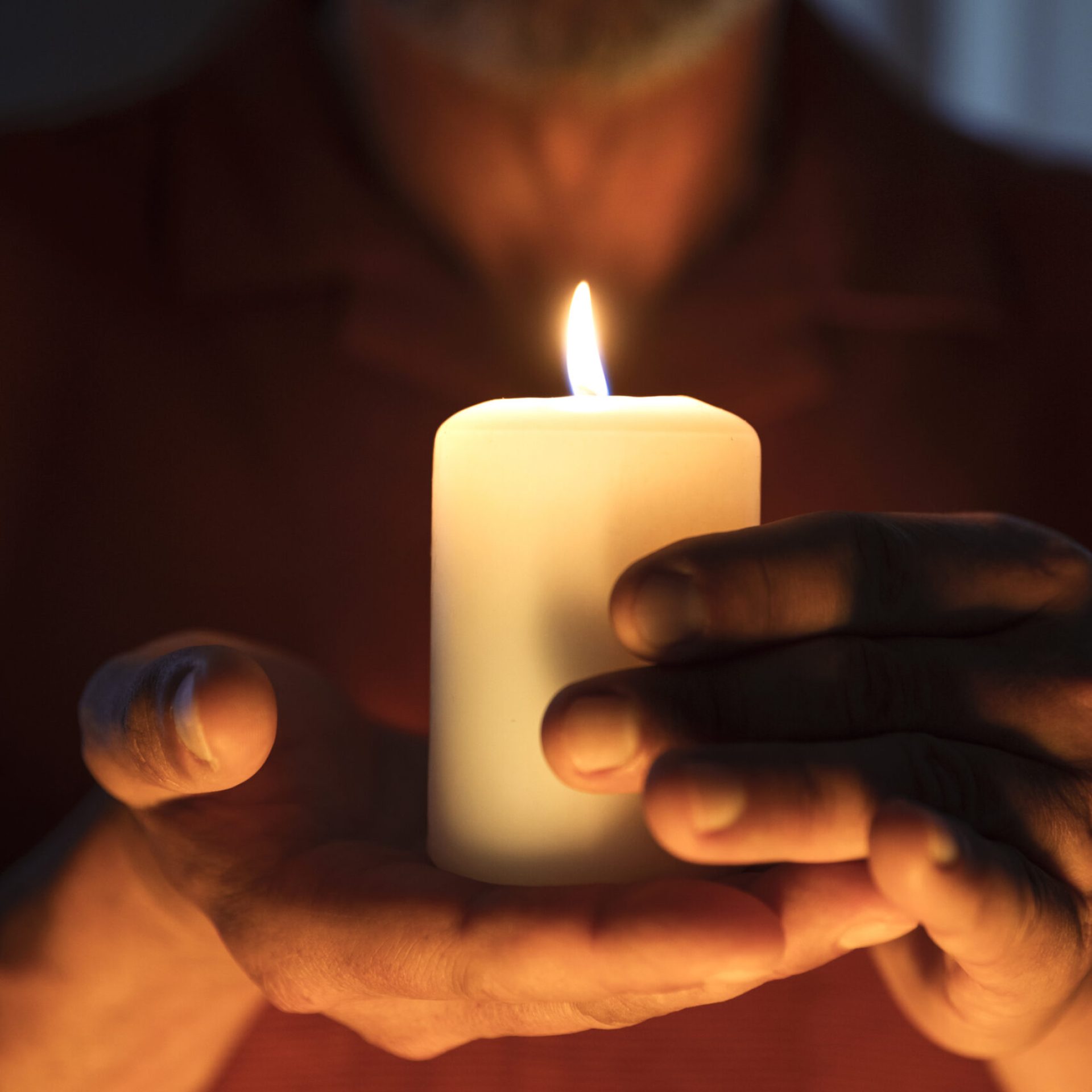 front-view-senior-man-holding-candle